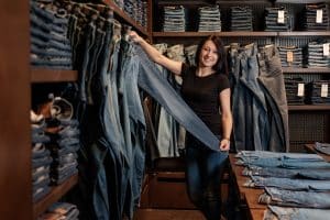 woman buying slim-cut jeans