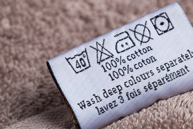 A detailed shot of a clothing label listing a fabric blend, such as 