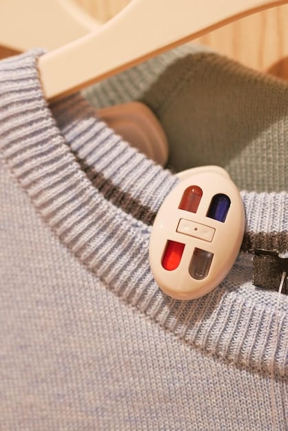A close-up shot of a capsule wardrobe, highlighting the texture and quality of the essential clothing items: a cashmere sweater, a pair of well-fitted jeans, a crisp white shirt, and a classic trench coat. The items are neatly folded and hung in an organized fashion.