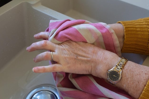 Close-up detail of a hand gently washing a silk scarf in a basin of cool, soapy water, highlighting the care and attention required for delicate fabrics.
