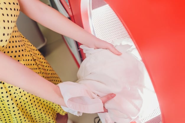 A mesh laundry bag containing a delicate lace garment inside a washing machine. Highlighting the protective measure used to prevent damage during machine washing.