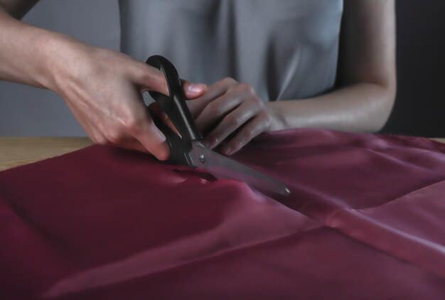 Close-up of a tailor's hands carefully pinning fabric on a dress form, adjusting the fabric to create a better fit around the waist and bust. The focus is on the precision and expertise of the tailor's work.