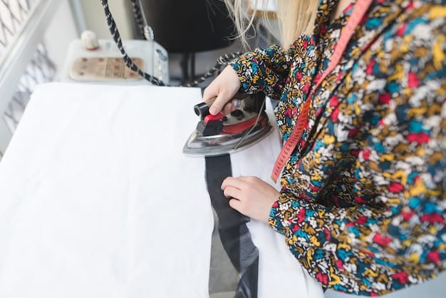 A close-up of a woman carefully ironing a silk blouse on a padded ironing board. She is using a low-heat setting and a pressing cloth to protect the fabric. The scene is well-lit, highlighting the smoothness of the ironed silk.
