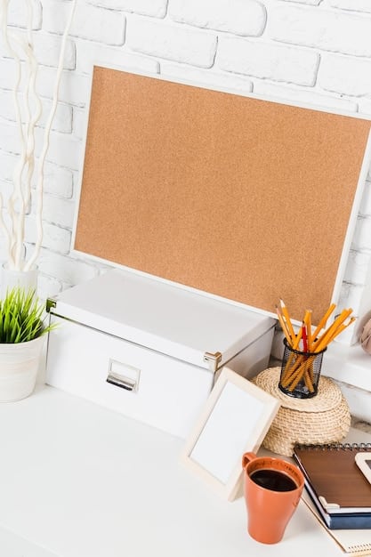 A well-organized home office desk with labeled file folders, a clean desktop, and a small plant, showcasing a minimalist and efficient workspace.