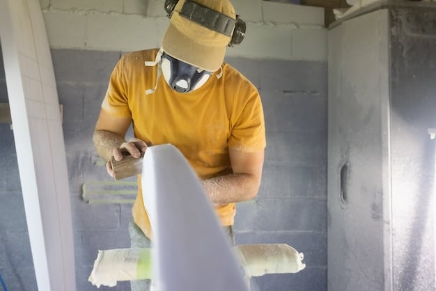 A person wearing protective gear (mask, gloves, suit) installing fiberglass insulation in an attic. The image should clearly show the proper safety precautions and techniques.