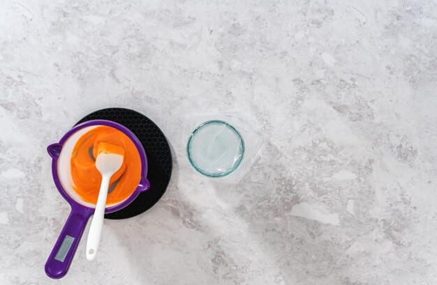 A close-up shot of a textured porcelain tile floor in a modern kitchen, highlighting its scratch resistance with utensils and cookware nearby.