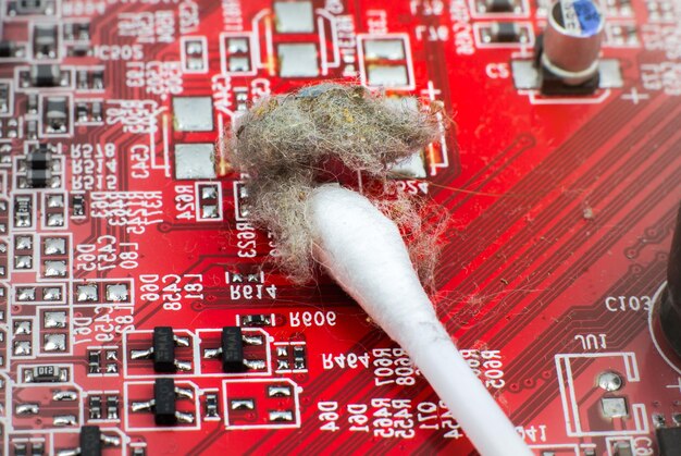 A close-up of a circuit board inside a Wi-Fi router, highlighting the complexity of the hardware and software components that require security regulations. Focus on the microchips and connection points, with a soft-focus background.