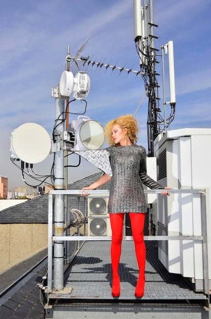 A picture of a modern 5G antenna installation, showcasing the complex electronic components and circuitry involved. The image emphasizes the reliance of telecommunications infrastructure on advanced semiconductor technology.