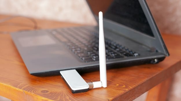 A close-up shot of various laptop ports (USB-C, HDMI, USB-A) on the side of a laptop, highlighting connectivity options. The laptop is placed on a wooden desk with a notebook and a pen nearby.