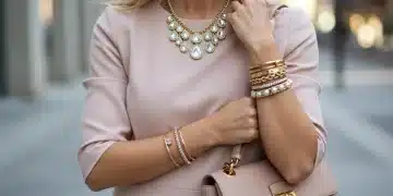 Woman showcasing elegant accessories including a necklace, bracelets, and handbag, embodying modern style.