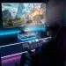 Futuristic gaming console setup with VR/AR glasses and holographic display.